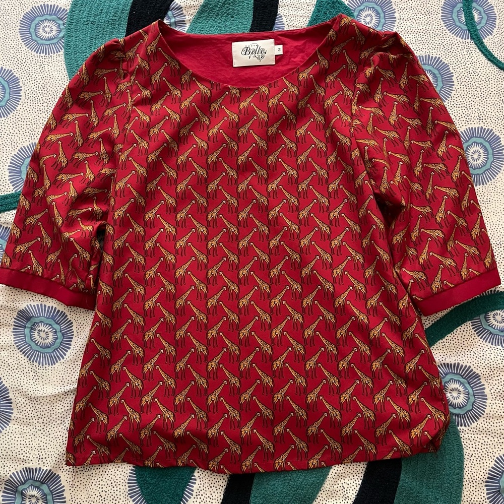 Short sleeve top with giraffe design from Anthropologie.